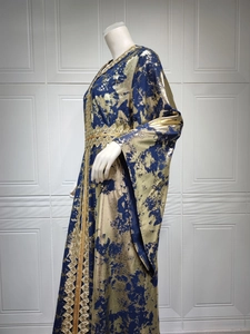 Detail of gold foil printing and intricate embroidery on the navy blue kaftan robe