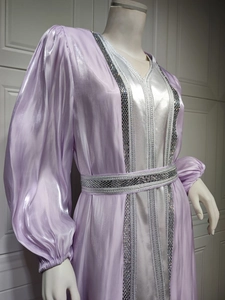 Detailed silver sequin trim and crystal beadwork on luxury lavender satin kaftan dress