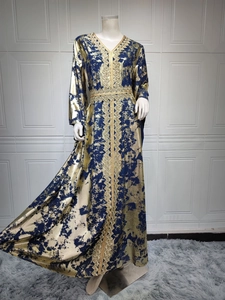 Detail of V-neck embroidery and gold metallic print on this navy blue chiffon caftan dress