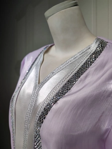 Detailed view of lavender satin evening gown collar with silver rhinestone and beadwork