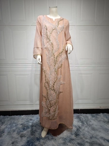 Elegant peach long-sleeved maxi dress with gold and silver sequin embroidery detail