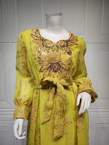 Detailed embroidery and sequins on lime green long sleeve caftan dress with gold accents