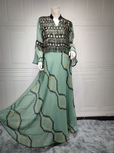 Detailed embroidery and gold tassel sequins on green floor-length evening gown
