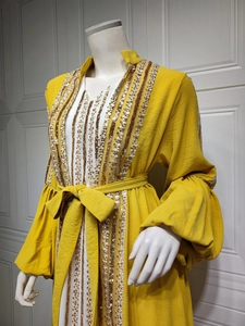Close-up of golden sequin stripe embroidery on long yellow kaftan dress set