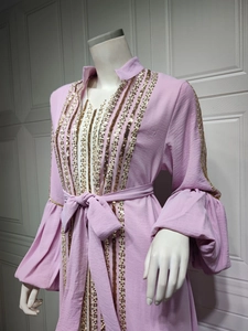 Detail of lavender puff sleeve dress with golden sequin embroidery and waist tie