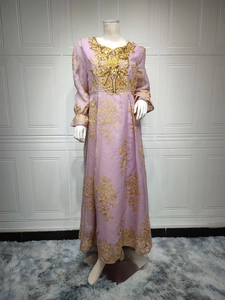 Detailed view of lavender gown with ornate gold sequin embroidery and beadwork on neckline