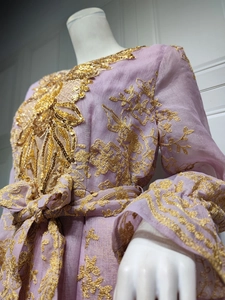Detailed embroidery and gold sequins on lavender long sleeve formal evening dress