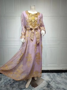 Detail of lavender dress featuring intricate gold floral embroidery and sequined collar