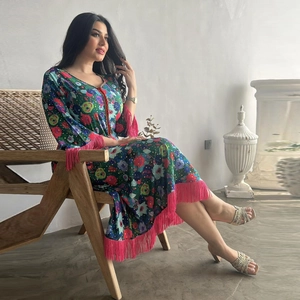 Ethnic printed kaftan maxi dress with colorful floral pattern and pink fringe hem