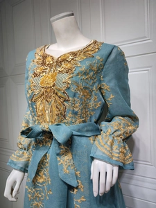 Detailed golden sequin embroidery on turquoise blue ethnic dress with bell sleeves