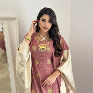 Elegant mauve and champagne kaftan dress featuring gold floral embroidery and linear patterns