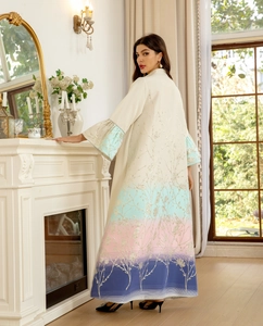 Detailed embroidery on a long-sleeved gradient abaya with elegant floral motifs