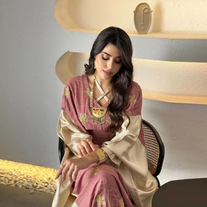 Detailed embroidery on rose pink long-sleeved dress with luxury gold satin patchwork