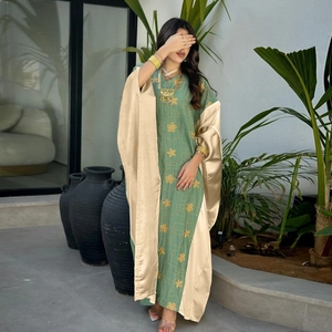 Elegant green Abaya dress with gold floral embroidery and champagne silk sleeves