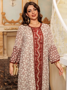 Detailed embroidery and red sequins on a beige long-sleeve mesh ethnic evening dress
