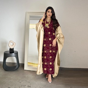 Detail view of burgundy Kaftan with gold embroidery and luxury satin overlay