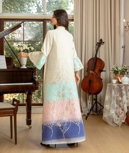 Detail view of jacquard floral embroidery and tricolor gradient hem on long abaya dress