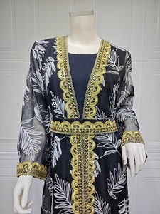 Detailed embroidery on black mesh caftan with gold sequin lace trim and leaf patterns