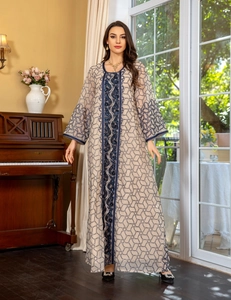 Detailed embroidery and sequins on a beige mesh Middle Eastern kaftan with blue patterns