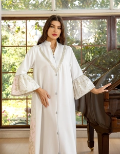 Detailed embroidery on the sleeve and hem of white jacquard kaftan dress