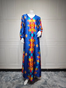 Close-up of royal blue satin dress featuring V-neck and colorful geometric floral patterns