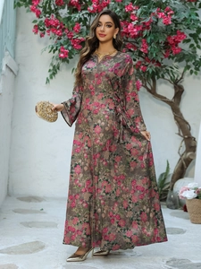 Detail of floral kaftan maxi dress with side drawstring and deep V-neckline