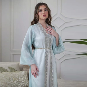 Detailed silver leaf embroidery on light blue puff sleeve abaya with metallic waist belt