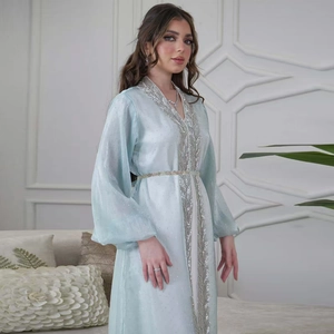 Detail of light blue kaftan with silver leaf embroidery and elegant lantern sleeves