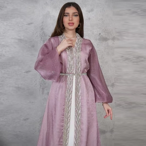 Detail of elegant purple kaftan with silver leaf embroidery and sparkling sequins finish