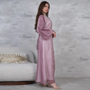 Detail of elegant purple puff sleeve robe with silver rhinestone accents and embroidery