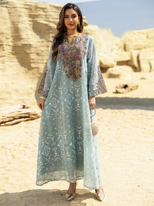 Detail of multi-color heavy embroidery on neckline and cuffs of light blue ethnic dress