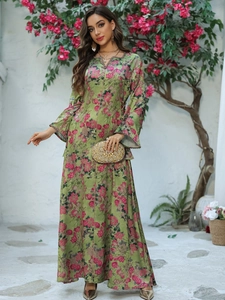 Detail of V-neck floral maxi dress with metallic trim and elegant flared sleeves