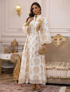 Detailed embroidery of golden leaves on a white stand collar jalabiya dress with belt