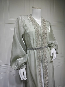 Detail view of the silver sequin embroidery and metallic fabric on this elegant kaftan