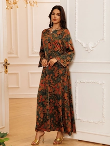 Detailed view of long sleeve floral kaftan dress with gold sequin trim and silky texture