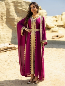 Detail of purple chiffon kaftan dress with golden lace embroidery and braided belt