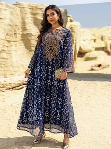 Detailed view of intricate colorful embroidery on dark blue ethnic maxi kaftan dress