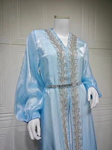 Sky blue kaftan gown featuring silver leaf embroidery and sparkly metallic fabric