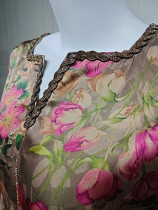 Detail showing high-quality beadwork embroidery on the floral champagne dress neckline