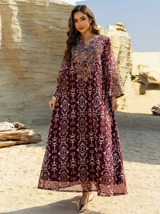 Detailed close-up of intricate embroidery on a wine red ethnic maxi dress for women