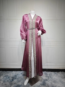 Detail of silver embroidery and rhinestone belt on purple puff sleeve kaftan dress