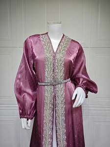 Detail of purple Abaya robe featuring silver sequin leaf embroidery and rhinestone belt