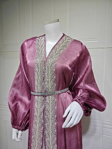 Detail of purple kaftan dress showing intricate silver embroidery and rhinestone belt
