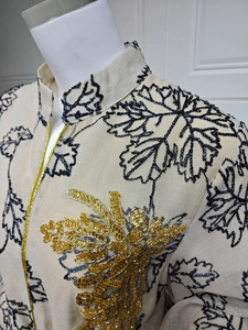 Detail of sequin embroidery and gold beadwork on ethnic jalabiya evening dress