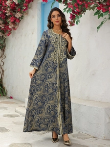 Exquisite golden embroidery and paisley pattern detail on a navy blue Kaftan evening dress
