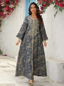 Close-up of luxury dark blue Kaftan dress with gold damask embroidery and flared sleeves