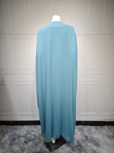Close-up of light blue chiffon abaya dress with a delicate lace ribbon trim detailing