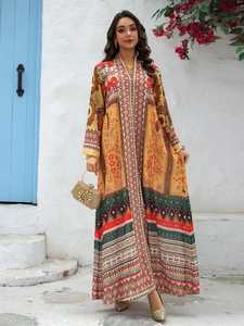 Close-up of ethnic print kaftan dress with V-neckline and intricate geometric patterns