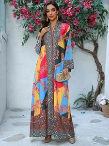 Close-up of bohemian style floral print maxi dress with rhinestones and vibrant patterns