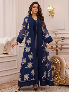 Detail of elegant navy abaya set featuring golden palm tree embroidery and sheer chiffon fabric